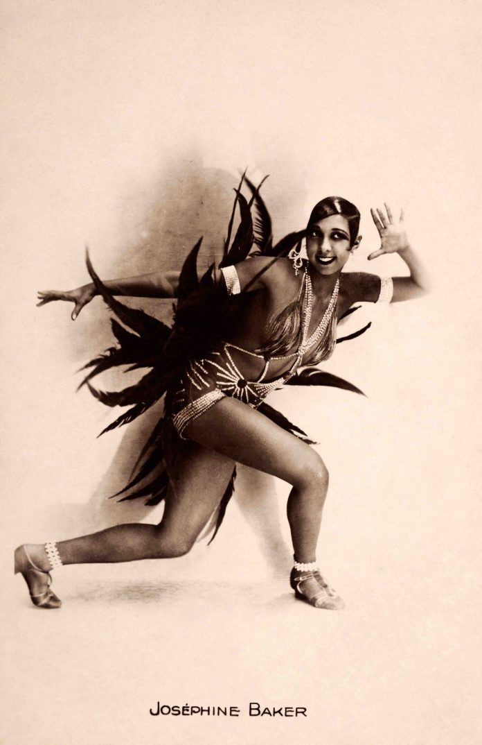 A vintage postcard featuring the American-born French entertainer Josephine Baker who was an icon of the 1920's Jazz Age, circa 1928. Baker headlined at the Folies Bergere in Paris, was the first African-American to star in a motion picture, a member of the French Resistance during World War Two and a spokesperson for the civil rights movement in the United States.